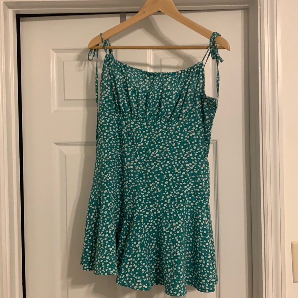 Green romper with flowers